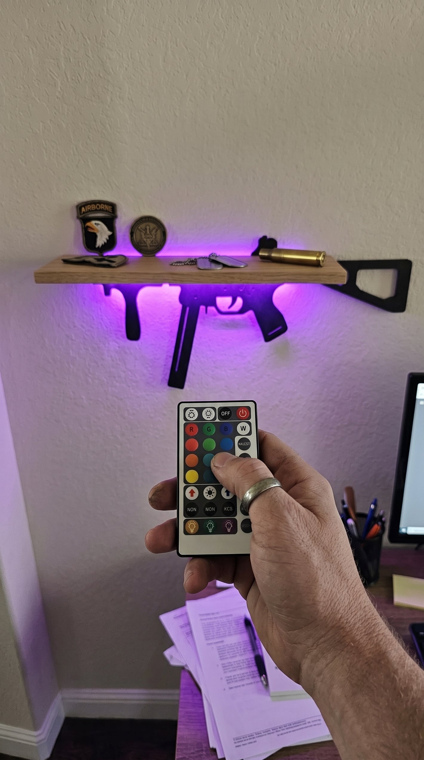 SMG style LED shelf glowing purple at night